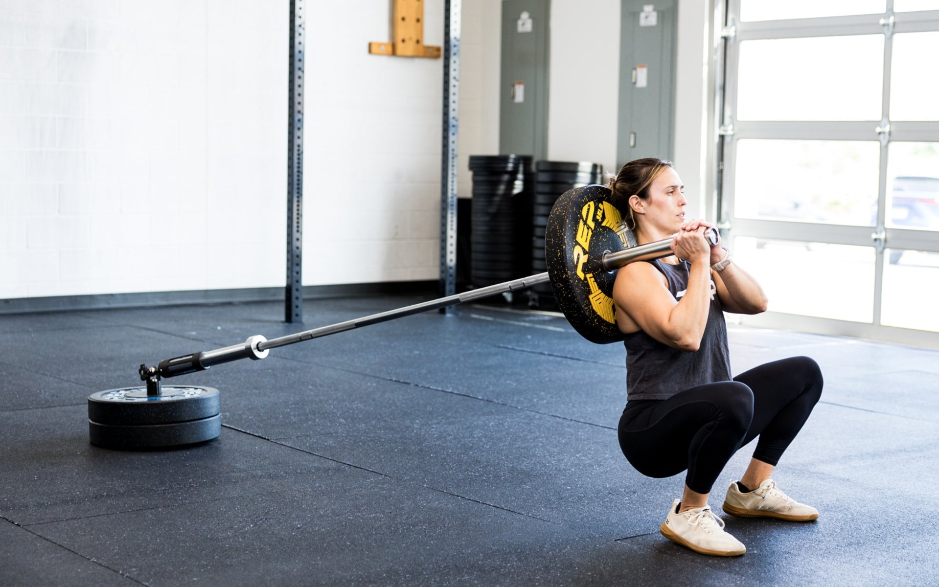 An athlete performing squats with the Free Standing REP® x Kleva Built® Adroit Landmine