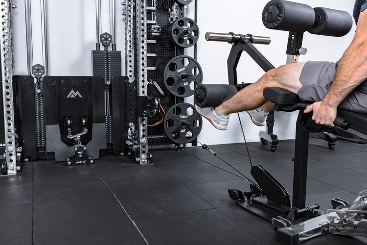 Athlete using only cable resistance on the Leg Extension & Leg Curl Bench Attachment