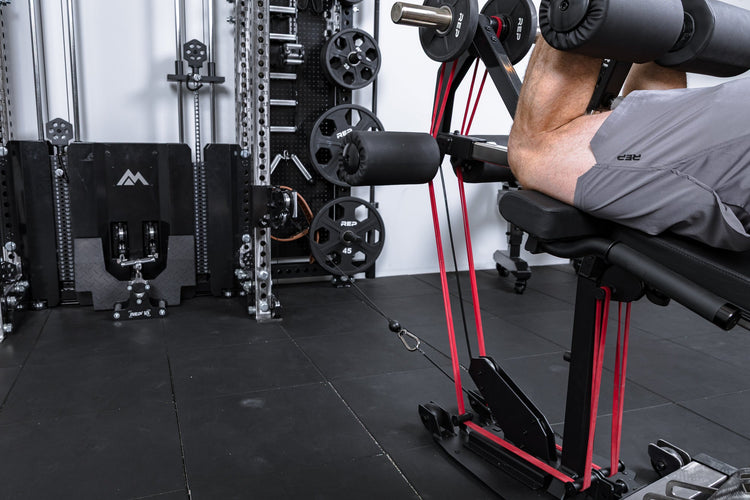 Athlete using all three types of resistance to workout on the Leg Extension & Leg Curl Bench Attachment