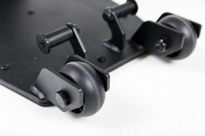 Close-up shot of the wheels on the Leg Extension & Leg Curl Bench Attachment